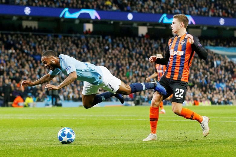 Manchester City's Raheem Sterling going down in the box in the first half of the Champions League tie against Shakhtar Donetsk on Wednesday. A penalty was awarded but he later admitted that there had been no contact from the defender Mykola Matviyenk