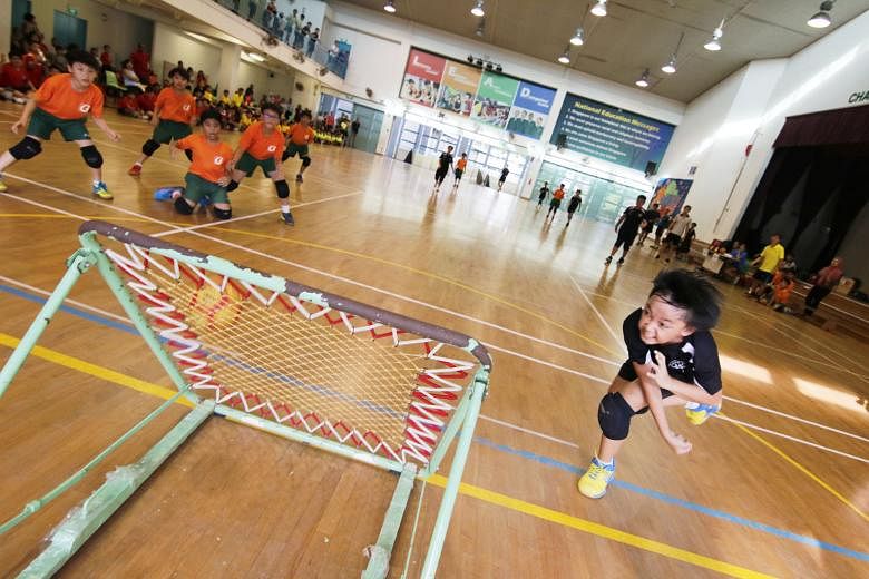 Dominic de Silva Agustus, 10, from Junyuan Primary, taking a shot in the SPH Foundation National Primary Schools Tchoukball Championships (junior division) boys' final yesterday at Farrer Park Primary. His team beat Farrer Park 7-6 to deny their oppo