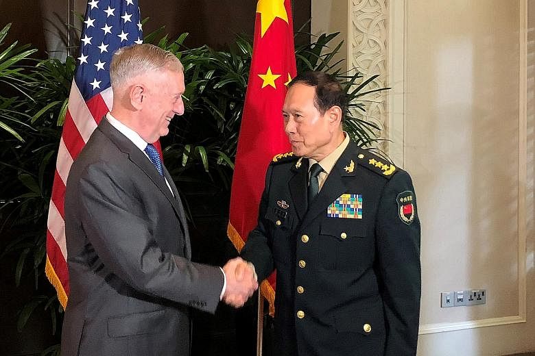 US Defence Secretary James Mattis and his Chinese counterpart, General Wei Fenghe, at a meeting in October. The two met again yesterday, for talks in Washington with other officials from both countries.