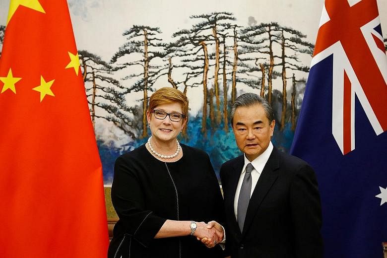 Australian Foreign Minister Marise Payne and Chinese Foreign Minister Wang Yi at a news conference in Beijing on Thursday.
