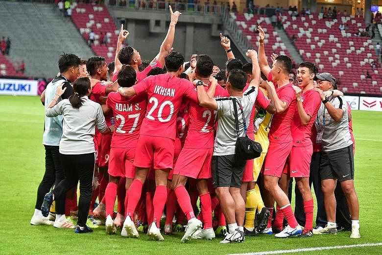 The joyous Lions after a job well done at the National Stadium last night, following their 1-0 victory over Indonesia.