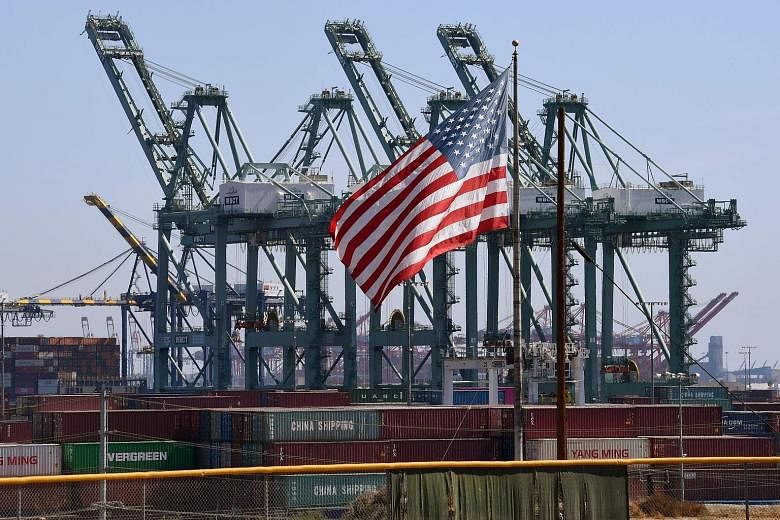 The US flag flying over Chinese shipping containers at the Port of Long Beach in Los Angeles County. Asian countries are watching to see if this week's midterm polls in the US will have an impact of the US-China trade war, among other issues.