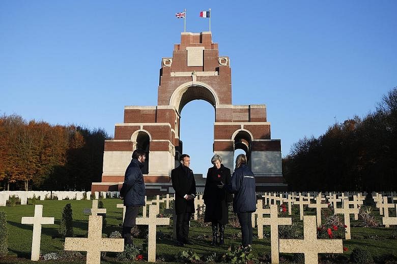 British Prime Minister Theresa May and French President Emmanuel Macron visiting the Thiepval Memorial in northern France last Friday as part of events commemorating the 100th anniversary of the World War I Armistice today.