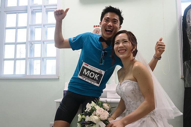 Mok Ying Ren and Belinda during their marathon-themed wedding gatecrash.