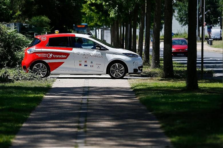 An autonomous car at a press presentation in the French city of Sotteville-les-Rouen earlier this year. Legal questions from traffic rules to liability in an accident ultimately will determine whether consumers  decide if they can live with driverl