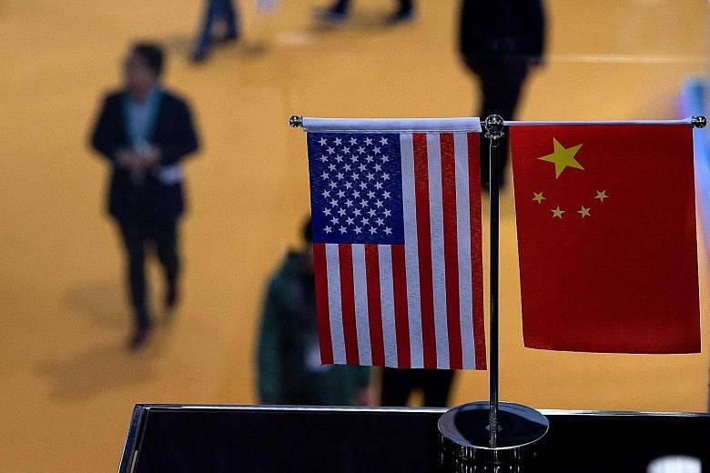 The tensions between China and the United States cannot just be seen through the Cold War lenses of superpower competition for dominance, the writer says. The world is at a historic inflection point, when America's turning away from its post-war glob