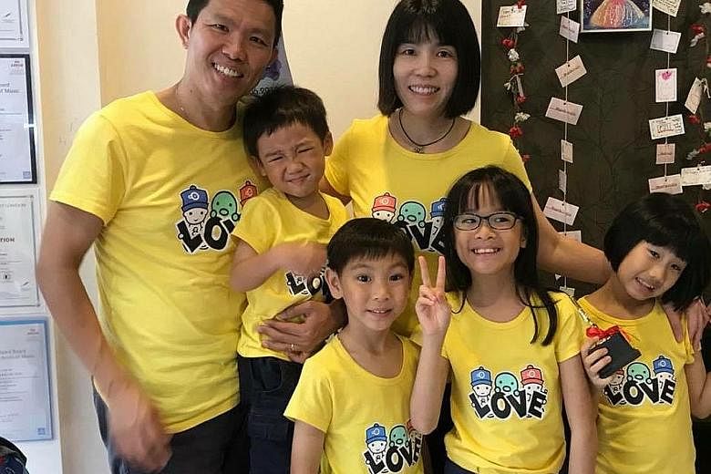 Mr Dickson Lim, 49, and his wife Allison Chong, 43, adopted their four children when they were newborn without asking to see their photos. Today, (from left) Alan is four; Daryl, six; Dawn, nine; and Amanda, eight. They attend student care and childc