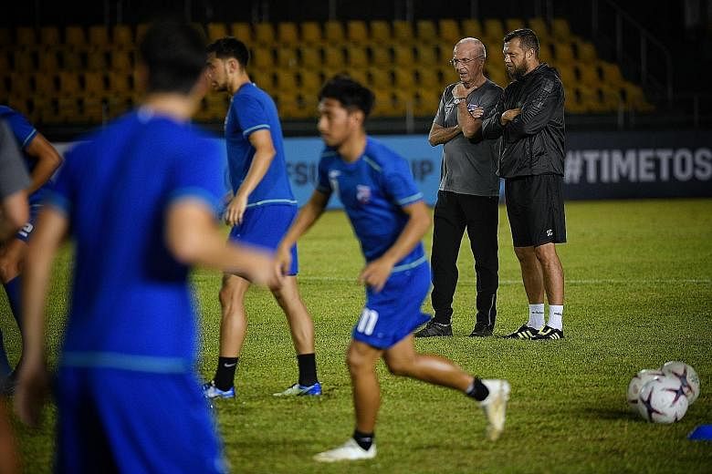 Philippines head coach Sven-Goran Eriksson and assistant coach Scott Cooper overseeing training at the Panaad Stadium in Bacolod City yesterday, ahead of their AFF Suzuki Cup opener against Singapore today.