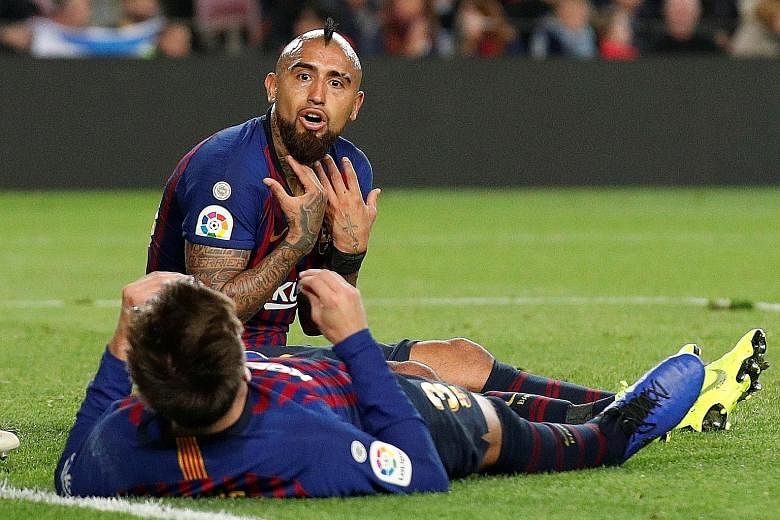 Barcelona's Gerard Pique (back to camera) and Arturo Vidal remonstrating after a missed chance in their 4-3 home defeat by Betis.