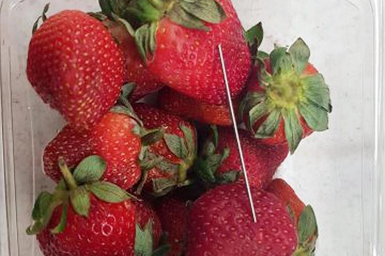 My Ut Trinh (above) has been charged with seven cases of contamination, in the first charges laid in the incidents. She is accused of being behind the spate of pins and needles found stuck in strawberries in Australia, as seen in this handout photo (