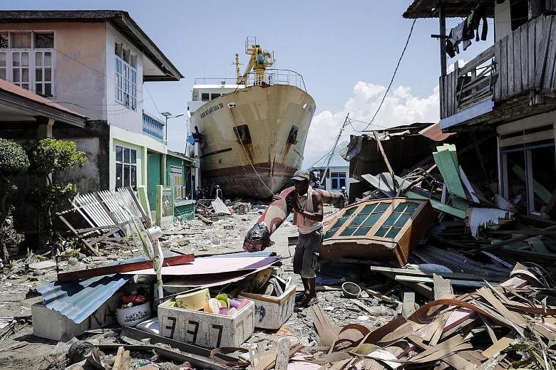 A stranded ship in Central Sulawesi, Indonesia, after a series of powerful earthquakes hit the area on Sept 28, triggering a tsunami. Almost 3,000 people were killed in Indonesia in the last three months or so from earthquakes, aftershocks and a Lion