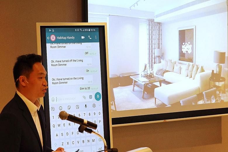 Mr Franklin Tang, chief executive of smart living platform developer Habitap, demonstrates how the Habitap Handy assistant can understand informally written text and ask follow-up questions to find out more about a user's request or instruction.