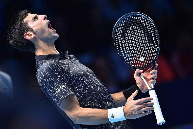 Novak Djokovic celebrating after winning a point against John Isner in their ATP World Finals round-robin match in London on Monday. He dispatched the big-serving American 6-4, 6-3 as his recent resurgence continued. The Serb has won 32 of 34 matches