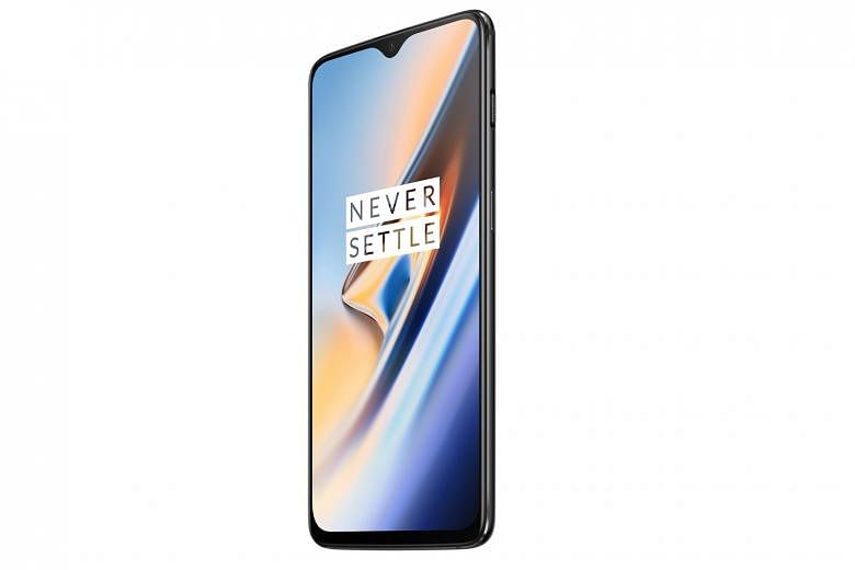 The OnePlus 6T has a 6.4-inch Oled screen, with narrow bezels all round and a relatively small chin.