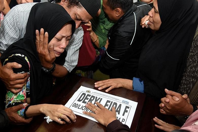 Ms Lutfinani Eka Putri, the wife of a Lion Air Flight JT610 passenger, reacting to the arrival of her husband's coffin in Surabaya on Tuesday.