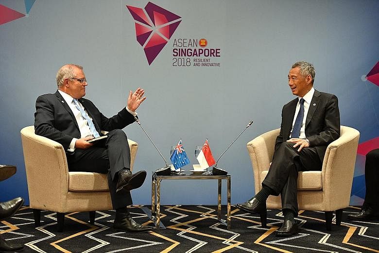 Prime Minister Lee Hsien Loong held meetings with (from left) Canadian Prime Minister Justin Trudeau, Australian Prime Minister Scott Morrison and Philippine President Rodrigo Duterte at the Suntec Singapore convention centre yesterday. PM Lee and Mr