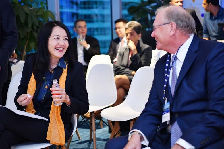 MAS deputy managing director Jacqueline Loh with Deutsche Bank CEO for Asia-Pacific Werner Steinmueller at yesterday's launch.