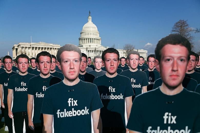 Cardboard cutouts of Mr Mark Zuckerberg, Facebook's chief executive, in front of the US Capitol in Washington in April. Facebook users learnt earlier this year that the company had compromised their privacy in its rush to expand, allowing access to t