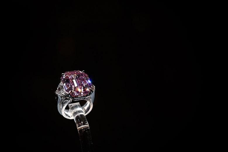 The Pink Legacy, weighing just under 19 carats, was once owned by the Oppenheimer family, who built De Beers into the world's biggest diamond trader.