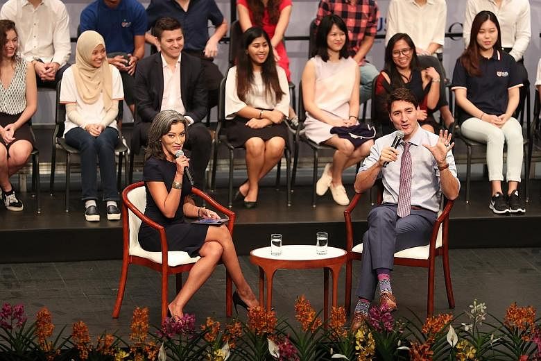 Canadian Prime Minister Justin Trudeau and BBC presenter Sharanjit Leyl at a dialogue at the National University of Singapore yesterday. Mr Trudeau said it was a careful balancing act engaging countries on human rights issues while building a working