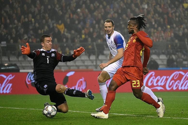 Michy Batshuayi, seen scoring his second, made the most of compatriot Romelu Lukaku's absence with both goals in Thursday's Nations League win over Iceland.