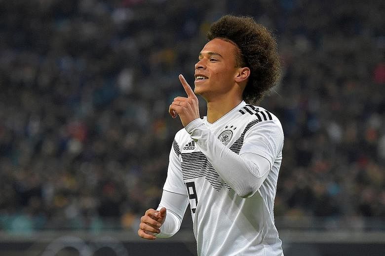 Manchester City winger Leroy Sane celebrates scoring the first goal in Germany's 3-0 win over Russia at the Red Bull Arena in Leipzig on Thursday.