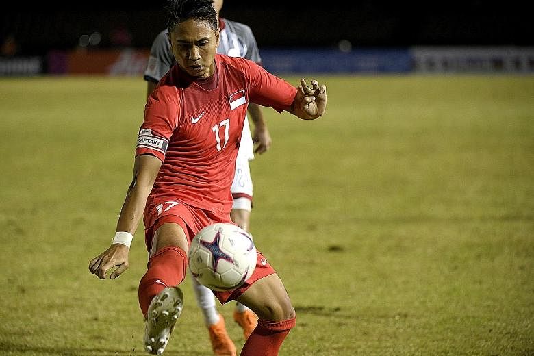 Shahril Ishak before his injury in the AFF Cup match in Bacolod, where he lasted only six minutes after coming on. He fell awkwardly after a mid-air challenge.