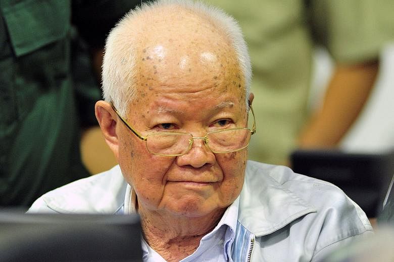 Nuon Chea (top) and Khieu Samphan (above) have been found responsible for genocidal actions by a UN-backed tribunal (left) which released its decision yesterday.