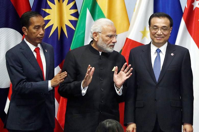 From left: Indonesia's President Joko Widodo, India's Prime Minister Narendra Modi and China's Premier Li Keqiang at the Regional Comprehensive Economic Partnership (RCEP) meeting in Singapore this week. The gulf between India and the other 15 RCEP c