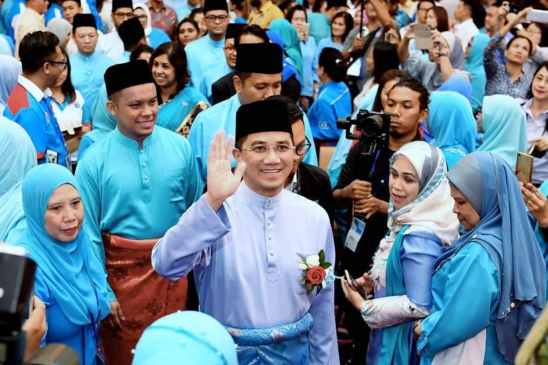 Mr Azmin Ali (waving) is now poised as a future premier in his own right. One observer said: "Azmin's people are now in key positions and if Anwar (Ibrahim) does not work with them, they may slow, or add uncertainty, to the latter's ascension."