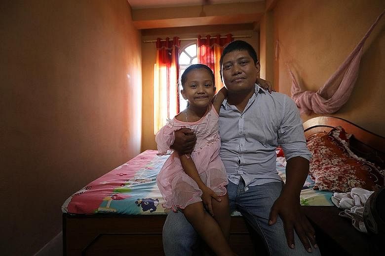 Hotel receptionist Dambar Jung Rana's daughter, Aaradhya, five, was warded in hospital two years ago for dengue fever. His 57-year-old father (not in photo) was infected as well. During that outbreak, nearly every household had one member come down w