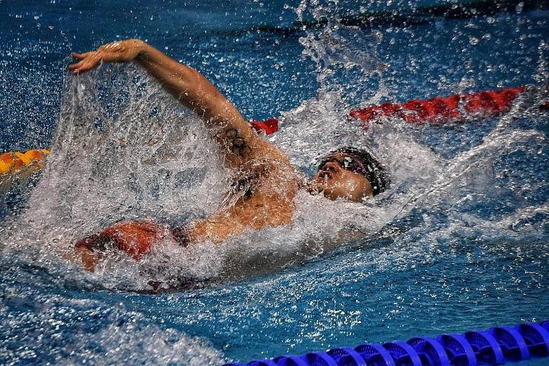 Joseph Schooling swimming the backstroke leg in the mixed 4x50m medley relay of the Fina World Cup Singapore leg yesterday. He set a national short-course record with his time of 24.08sec. 