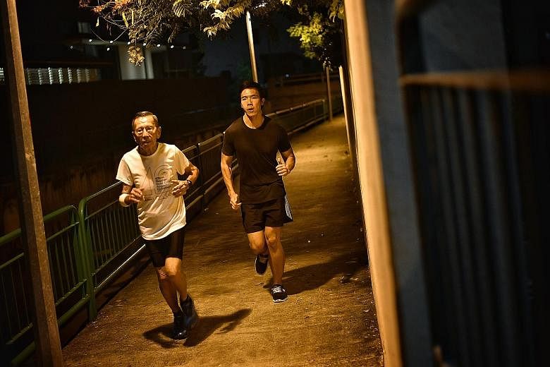 The writer Justin Kor trying to keep pace with his grandfather, Kor Hong Fatt, while training for next month's Standard Chartered Singapore Marathon.
