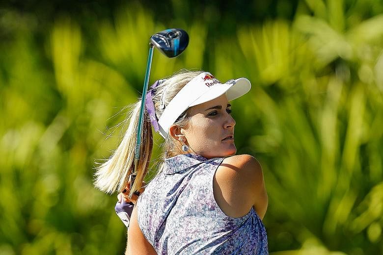 Lexi Thompson teeing off on the 15th hole during the second round of the LPGA Tour Championship in Naples, Florida. She carded a 67 for a 132 total and a three-shot lead.