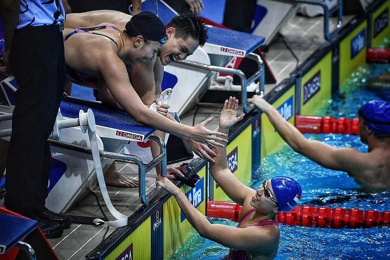 Schooling combined with Roanne Ho, Amanda Lim (in pool) and Teong Tzen Wei (not pictured) to win the medley relay silver in 1min 42.21sec, behind Australia in 1:39.69.