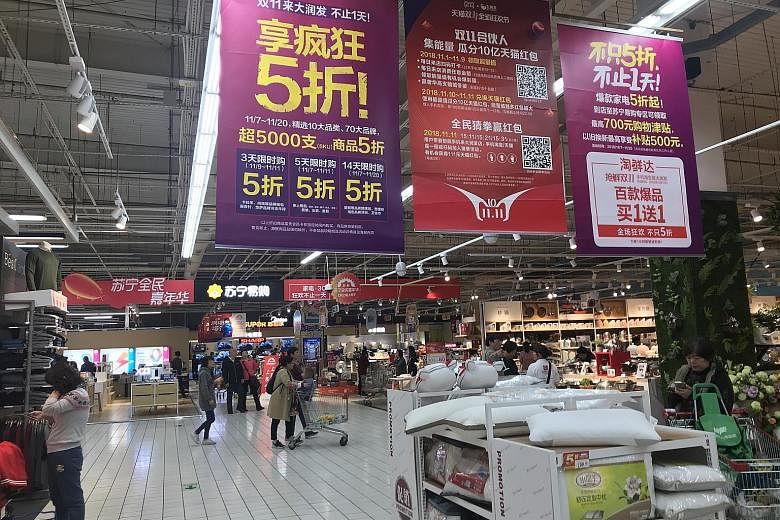 RT-Mart in Shanghai held promotions on Singles' Day to lure shoppers to buy from the physical store, as well as go online for bigger discounts.