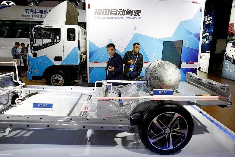 The frame of an electric vehicle displayed at a car exhibition in Beijing last month. Auto experts believe that short-haul trucks that ply intra-city delivery routes are a natural home for battery electric technology.