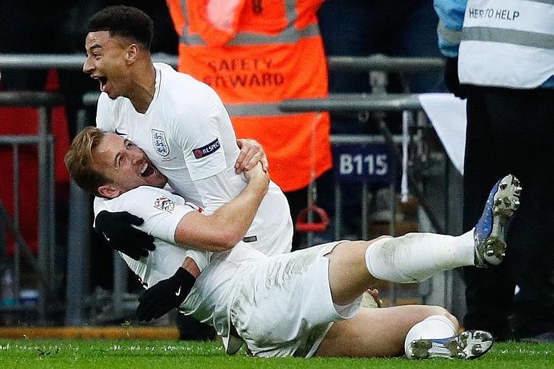 Jesse Lingard (wearing gloves) embracing Harry Kane after the England captain scored a late winner against Croatia to seal their passage into the Nations League semi-finals. Lingard had earlier equalised for the World Cup semi-finalists after the Cro