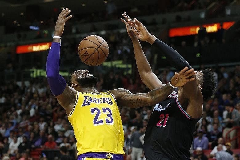 Lakers forward LeBron James is defended by Heat centre Hassan Whiteside during their NBA game in Miami, Florida on Sunday. Whiteside and his team had few answers to James' wizardry in Los Angeles' 113-97 victory.