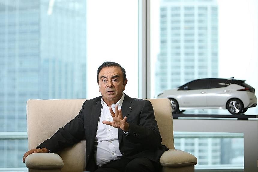 Mr Carlos Ghosn, seen here giving an interview in September at Nissan's headquarters in Yokohama, is said to have under-reported nearly 10 billion yen (S$122 million) in compensation as around five billion yen. Mr Ghosn is also the chief executive of