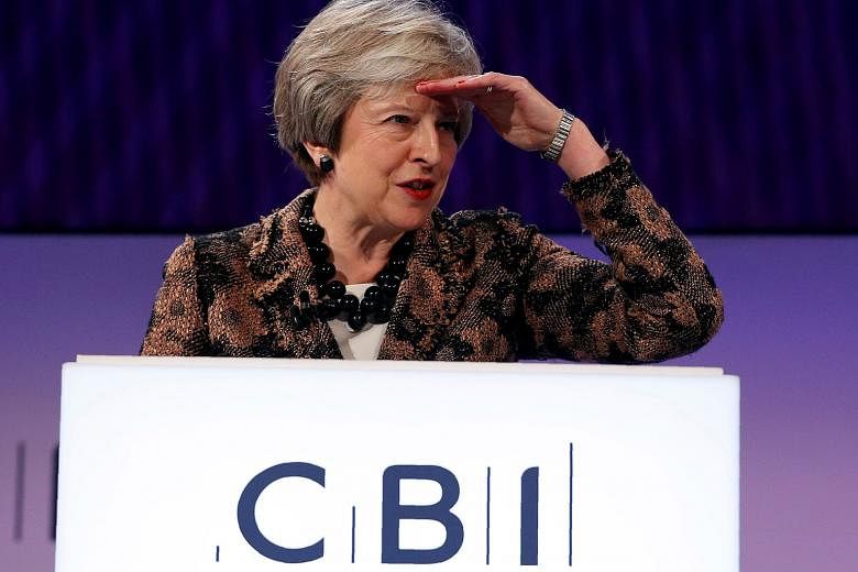 Britain's Prime Minister Theresa May told the Confederation of British Industry conference in London yesterday that she was "determined to deliver" her Brexit deal.