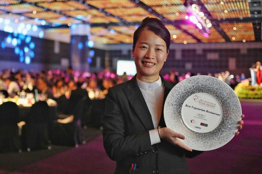 Above: LingZhi's general manager Fanny Chen, 41, with the Best Vegetarian Restaurant award for the eatery at the Restaurant Association of Singapore's annual awards gala at Suntec City yesterday. Left: Mr Hong Junchen, 33, is co-founder of Nude Chill