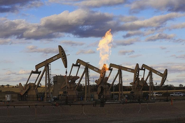 Pumpjacks at an oil well site near Epping, North Dakota. The United States' West Texas Intermediate crude futures ended Tuesday's session down US$3.77, or 6.6 per cent, at US$53.43 per barrel. The contract fell as much as 7.7 per cent to touch US$52.