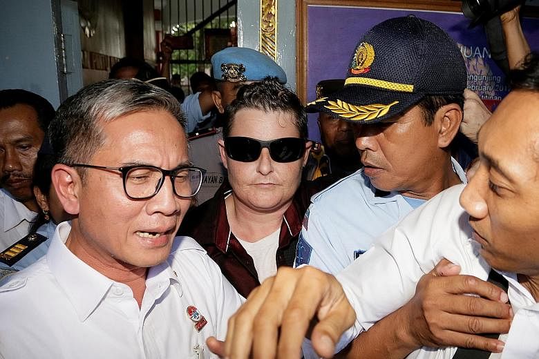 Renae Lawrence (with sunglasses) being released from prison in Bangli Regency, Bali, yesterday. She was taken to a detention centre while waiting for an overnight flight to Sydney.
