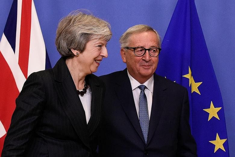 British Prime Minister Theresa May and EU Commission president Jean-Claude Juncker after their meeting at the EU's headquarters in Brussels on Wednesday.