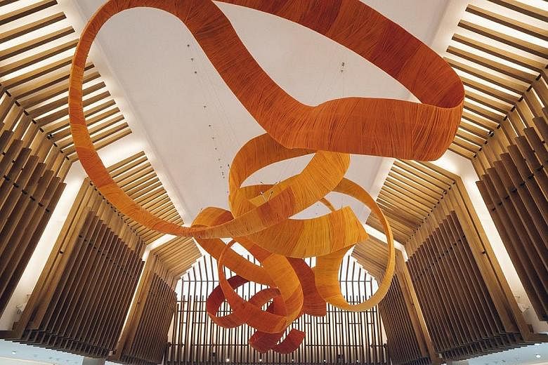 The T Galleria by DFS in Siem Reap, Cambodia, features reflecting pools, verdant gardens and works by local artists. This art installation in the central atrium was inspired by the warm colours of Buddhist monks' robes.