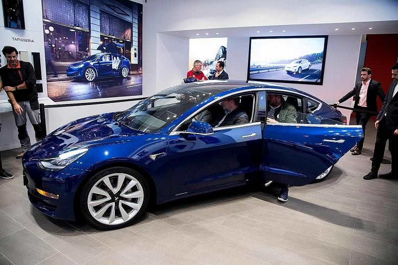 The Tesla Model 3 was expected to compete in the premium sedan market against the likes of Audi and BMW, but owners of mass-market cars are willing to pay for the sedan.