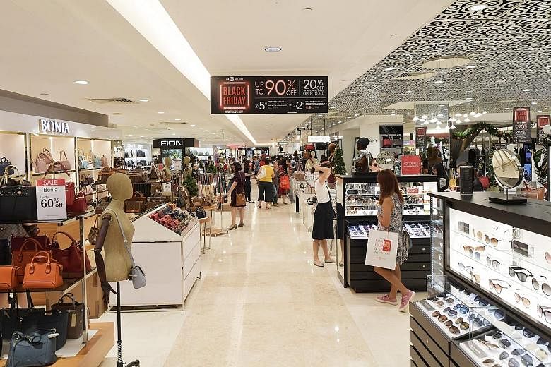 Above: A queue for beauty vouchers at Tangs in Orchard Road on Black Friday. Tangs was among the stores that saw throngs of shoppers eager to snap up deals and limited-edition items. Below: At department store Metro's Paragon outlet, shoppers could g