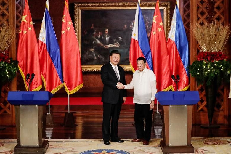 Chinese President Xi Jinping (left) and Philippine President Rodrigo Duterte at the Malacanang Presidential Palace in Manila on Tuesday. The 29 deals signed during Mr Xi's visit were mostly generic MOUs, letters of intent and framework agreements.
