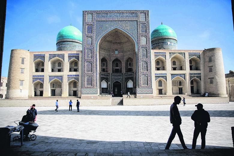 The Mir-i-Arab Madrasa in Bukhara, a city in Uzbekistan where glistening turquoise domes, ornate mosques, ancient forts and layer upon layer of living history dot the landscape. Left: Old-world charm mixes with modern-day glitz in Baku, capital of Az